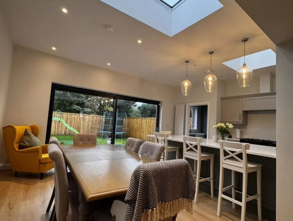 Open plan dining space with sliding garden doors