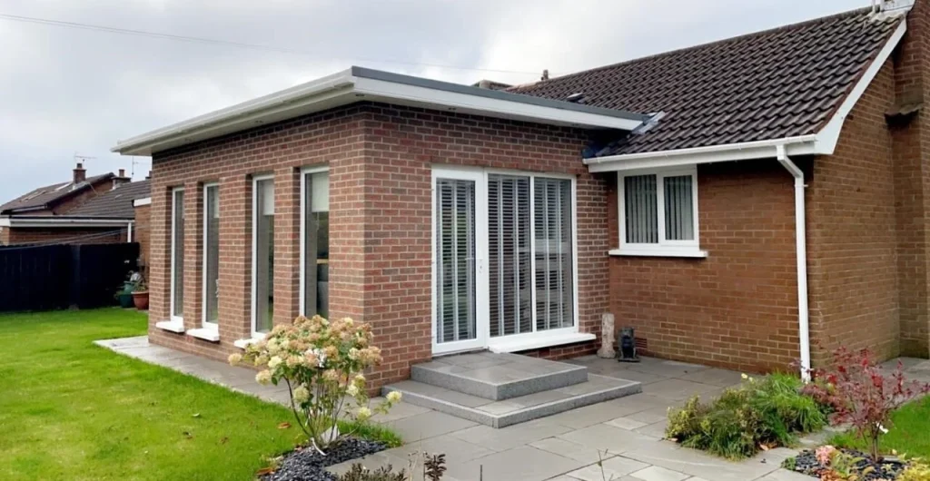 Brick extension opening onto the garden