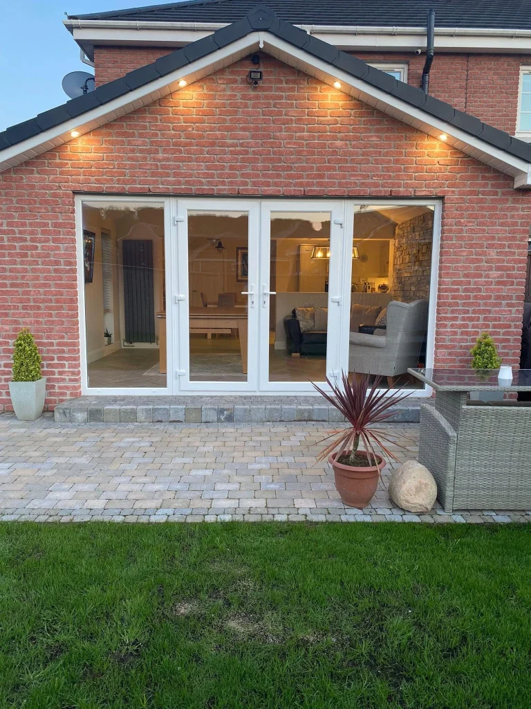 Brick extension with pitched roof and garden doors