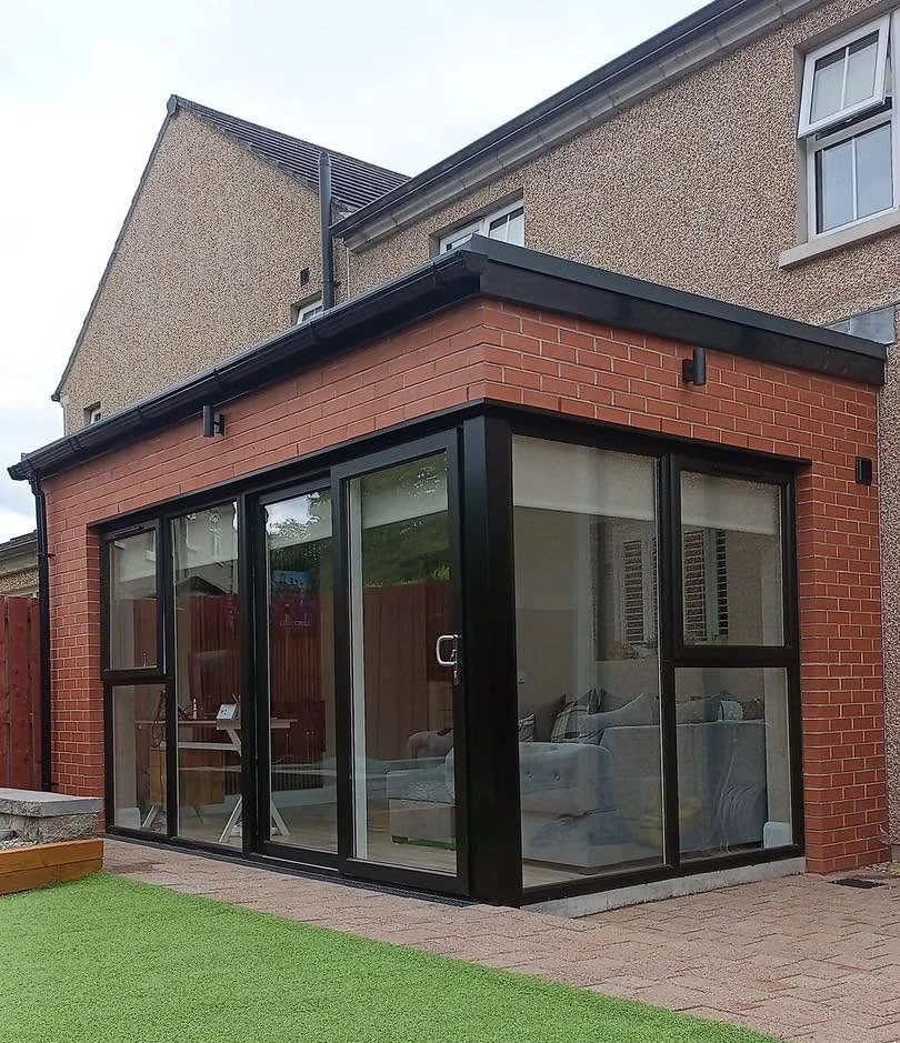 Completed brick extension with black framed glazing