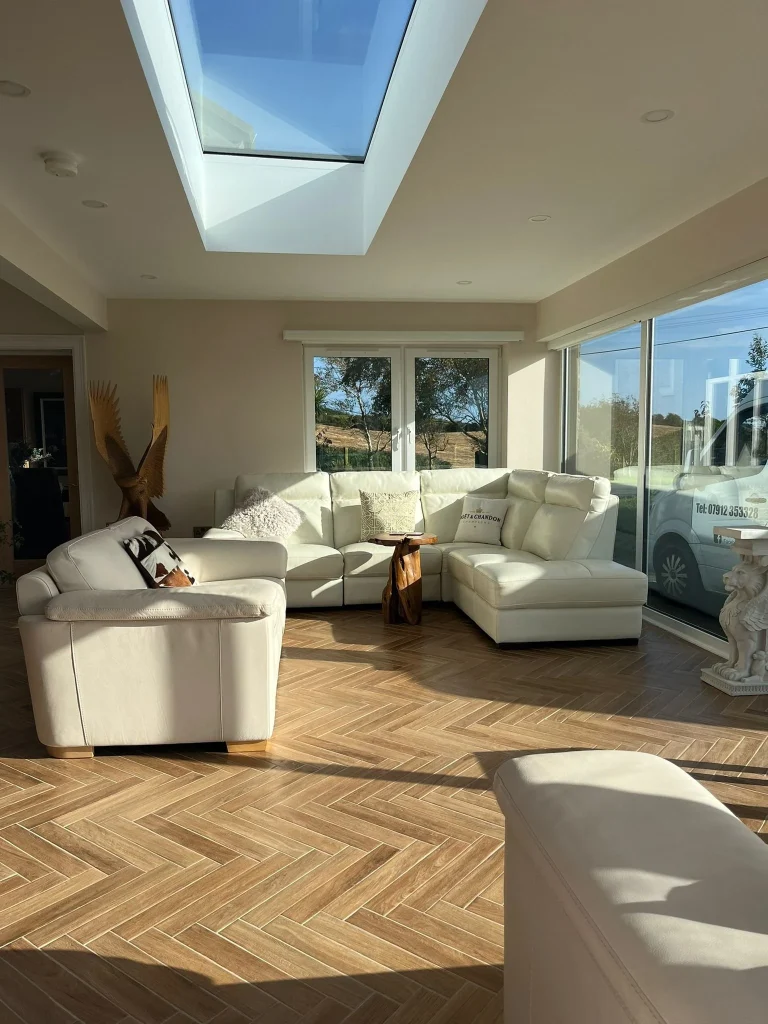 Furnished living room beneath a rooflight