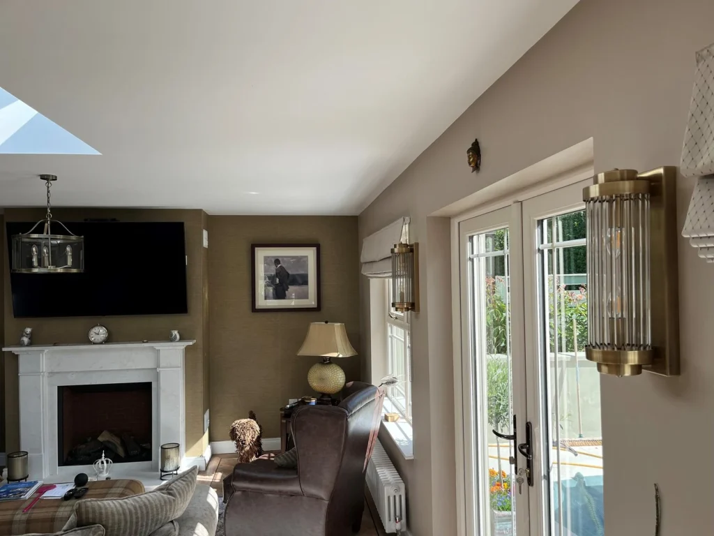Living room with fireplace and garden glazing