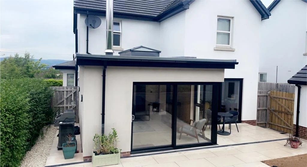 Completed sunroom opening onto the garden terrace