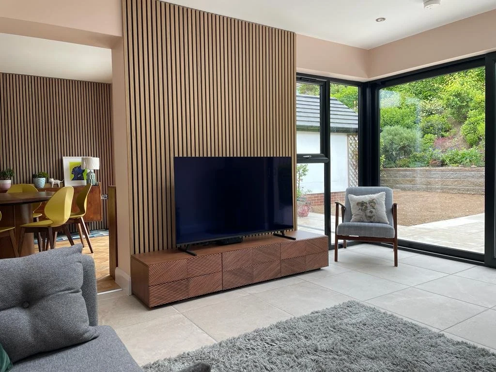 Timber feature wall beside the seating and dining areas