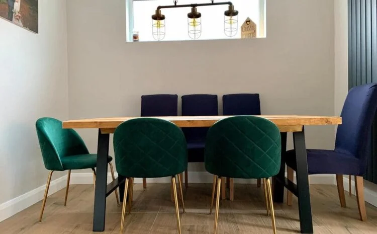 A completed dining area with a timber table and upholstered chairs