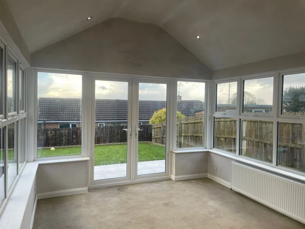 Sunroom interior with windows on three sides