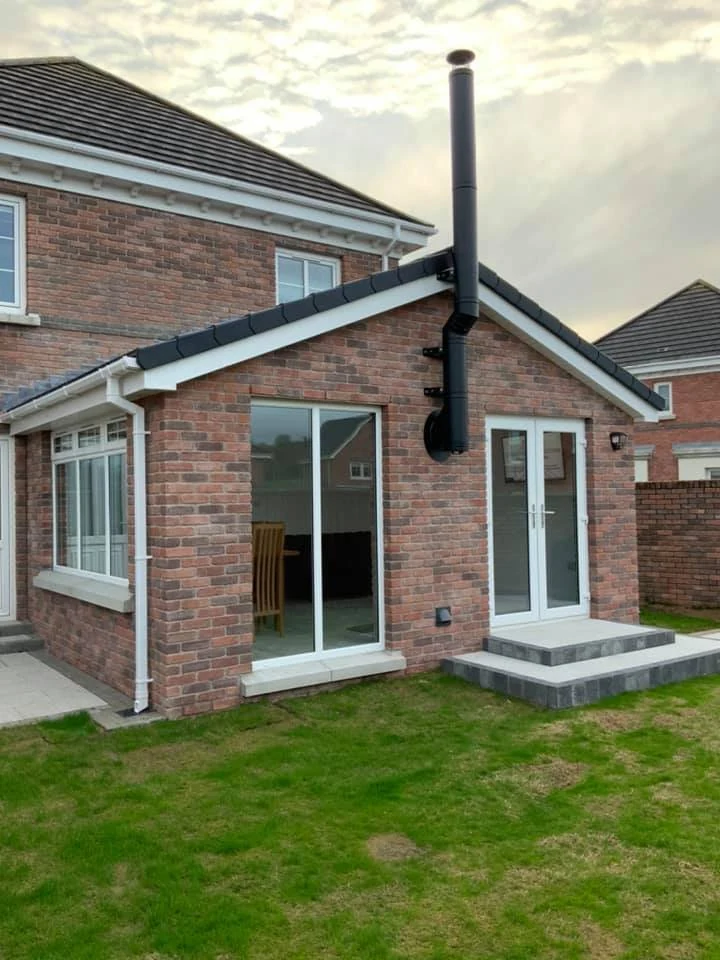 Completed brick sunroom with glazed garden doors